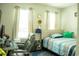 Cozy bedroom with natural light, a comfortable bed, and a dedicated workspace at 608 Washington Way, Haines City, FL 33844