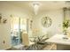 Dining area features a glass table and a view to the backyard at 608 Washington Way, Haines City, FL 33844