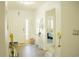 Welcoming entryway with hardwood flooring, elegant decor, and ample natural light at 608 Washington Way, Haines City, FL 33844