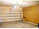 Interior view of the garage featuring a white garage door and Chamberlain opener at 608 Washington Way, Haines City, FL 33844