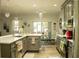 Bright kitchen and dining area with a modern chandelier and lots of natural light at 608 Washington Way, Haines City, FL 33844