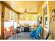 Enclosed lanai with grill, ceiling fan, and seating at 608 Washington Way, Haines City, FL 33844