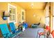 Enclosed lanai with colorful furniture at 608 Washington Way, Haines City, FL 33844