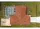 Aerial view of a home with a red tile roof, screened-in pool, and expansive backyard at 611 Jura Ln, Kissimmee, FL 34759