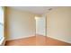 Bright bedroom with neutral walls, tile flooring, and an open doorway offers a flexible living space at 611 Jura Ln, Kissimmee, FL 34759