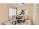 Dining room with table and chairs set on floral area rug at 611 Jura Ln, Kissimmee, FL 34759