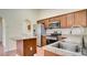 Kitchen with stainless steel appliances, granite countertops, and wood cabinets at 611 Jura Ln, Kissimmee, FL 34759