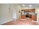Kitchen with stainless steel appliances, granite countertops, and wood cabinets at 611 Jura Ln, Kissimmee, FL 34759