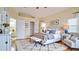 Serene main bedroom with a tray ceiling, stylish decor, and ample natural light for comfort and relaxation at 611 Jura Ln, Kissimmee, FL 34759