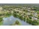 Desirable neighborhood with mature trees, a tranquil pond, and a home with a lush private yard at 614 S Amelia Ave, Deland, FL 32724
