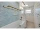 Updated bathroom featuring a glass shower door and fish wallpaper design at 614 S Amelia Ave, Deland, FL 32724