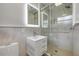 Modern bathroom with a glass-enclosed shower, elegant vanity, and sleek fixtures at 614 S Amelia Ave, Deland, FL 32724