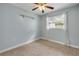 Relaxing bedroom featuring window and storage at 614 S Amelia Ave, Deland, FL 32724