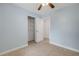 Bright bedroom features a ceiling fan, closet, and light blue painted walls at 614 S Amelia Ave, Deland, FL 32724