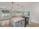 Open-concept kitchen with views of the living area, providing a seamless flow for entertaining and daily living at 614 S Amelia Ave, Deland, FL 32724
