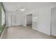 Living room showcasing terrazzo floors and light-filled interiors with elegant french doors at 614 S Amelia Ave, Deland, FL 32724