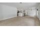 Spacious living room with a view of the kitchen bar, lots of room, and neutral colors to make it home at 614 S Amelia Ave, Deland, FL 32724