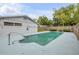 Backyard features a private pool with metal ladder at 614 S Amelia Ave, Deland, FL 32724