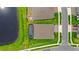 Overhead view of backyard featuring pool, patio, yard, and modern home; the perfect space for outdoor relaxation and entertaining at 6348 Mossy Oak Rd, St Cloud, FL 34771