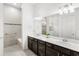 The bathroom offers a double vanity, walk-in shower, and modern fixtures at 6348 Mossy Oak Rd, St Cloud, FL 34771