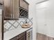Charming butler's pantry with wine storage and stylish backsplash, ideal for entertaining at 6348 Mossy Oak Rd, St Cloud, FL 34771