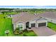 Charming single-Gathering home with a well-manicured lawn, two-car garage, and a welcoming front entrance at 6348 Mossy Oak Rd, St Cloud, FL 34771