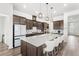 Gourmet kitchen featuring a large center island, stainless steel appliances, and ample cabinetry at 6348 Mossy Oak Rd, St Cloud, FL 34771