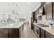 Bright open-concept kitchen featuring a large island, modern appliances, and stylish design at 6348 Mossy Oak Rd, St Cloud, FL 34771