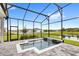 Screened in porch with a plunge pool, and view of the pond at 6348 Mossy Oak Rd, St Cloud, FL 34771