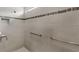 Walk-in shower with neutral-toned tiling and a built-in bench at 6348 Mossy Oak Rd, St Cloud, FL 34771