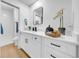 Bathroom featuring a modern vanity with stone countertop, a mirror, and a glass shower at 6505 Dorchester Rd, Lakeland, FL 33809