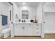 Bathroom features a modern vanity with stone countertop, toilet, and a walk-in closet at 6505 Dorchester Rd, Lakeland, FL 33809