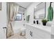 Beautiful bathroom featuring large vanity, dark fixtures, and shower at 6505 Dorchester Rd, Lakeland, FL 33809
