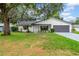 Charming single-story home with a well-manicured lawn and inviting curb appeal at 6505 Dorchester Rd, Lakeland, FL 33809