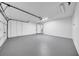 Spacious garage with painted floors, white doors, and ample lighting at 6505 Dorchester Rd, Lakeland, FL 33809