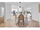 Cozy dining area next to kitchen features sleek white cabinets at 6505 Dorchester Rd, Lakeland, FL 33809
