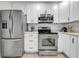 Modern kitchen features stainless steel appliances and white cabinets at 6505 Dorchester Rd, Lakeland, FL 33809