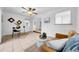 Cozy living room with a ceiling fan, an adjacent office area, and lots of natural light at 6505 Dorchester Rd, Lakeland, FL 33809