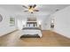Main bedroom with a ceiling fan and a large window for natural light at 6505 Dorchester Rd, Lakeland, FL 33809