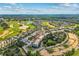 Aerial shot of the property showing its proximity to the golf course and other amenities at 7509 Mourning Dove Cir # 302, Reunion, FL 34747