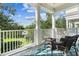 Cozy balcony with chairs overlooking lush greenery and the surrounding neighborhood at 7509 Mourning Dove Cir # 302, Reunion, FL 34747
