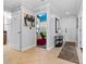Tiled foyer and hallway leading to a bedroom and a front door entrance at 7509 Mourning Dove Cir # 302, Reunion, FL 34747