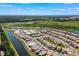 Aerial view of an expansive residential community with waterways and recreational areas at 8106 Mabury Ln, Orlando, FL 32832