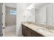 Bathroom featuring double sinks, granite countertops, a large mirror, and a tub/shower at 8106 Mabury Ln, Orlando, FL 32832