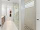 Modern bathroom showcasing a glass shower with multiple shower heads and neutral tiling at 8106 Mabury Ln, Orlando, FL 32832