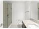 Modern bathroom featuring a granite vanity and glass-enclosed shower at 8106 Mabury Ln, Orlando, FL 32832