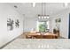 Open dining and living areas with wood floors and plenty of natural light at 8106 Mabury Ln, Orlando, FL 32832