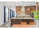 Open kitchen design featuring barstool seating, stainless steel appliances, and designer backsplash at 8106 Mabury Ln, Orlando, FL 32832