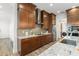 Modern kitchen with granite countertops, stainless steel appliances, and ample cabinet space at 8106 Mabury Ln, Orlando, FL 32832