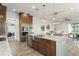 Modern kitchen featuring a large island with seating and stainless steel appliances at 8106 Mabury Ln, Orlando, FL 32832